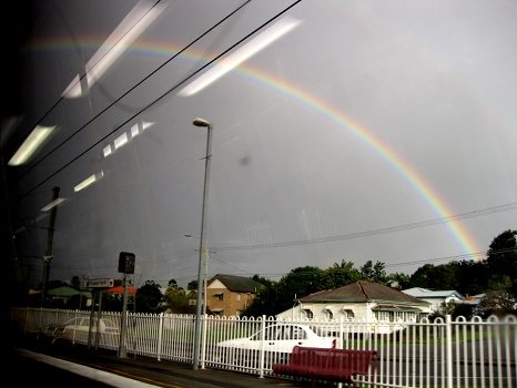 Rainbow out the train window